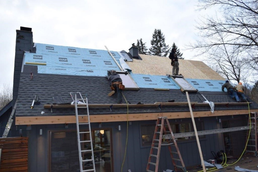 Worker Bee crew installing underlayment and shingles on a GTA home