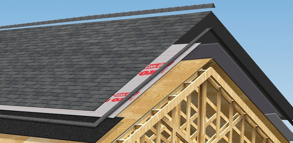 Crew installing asphalt shingles on a residential roof